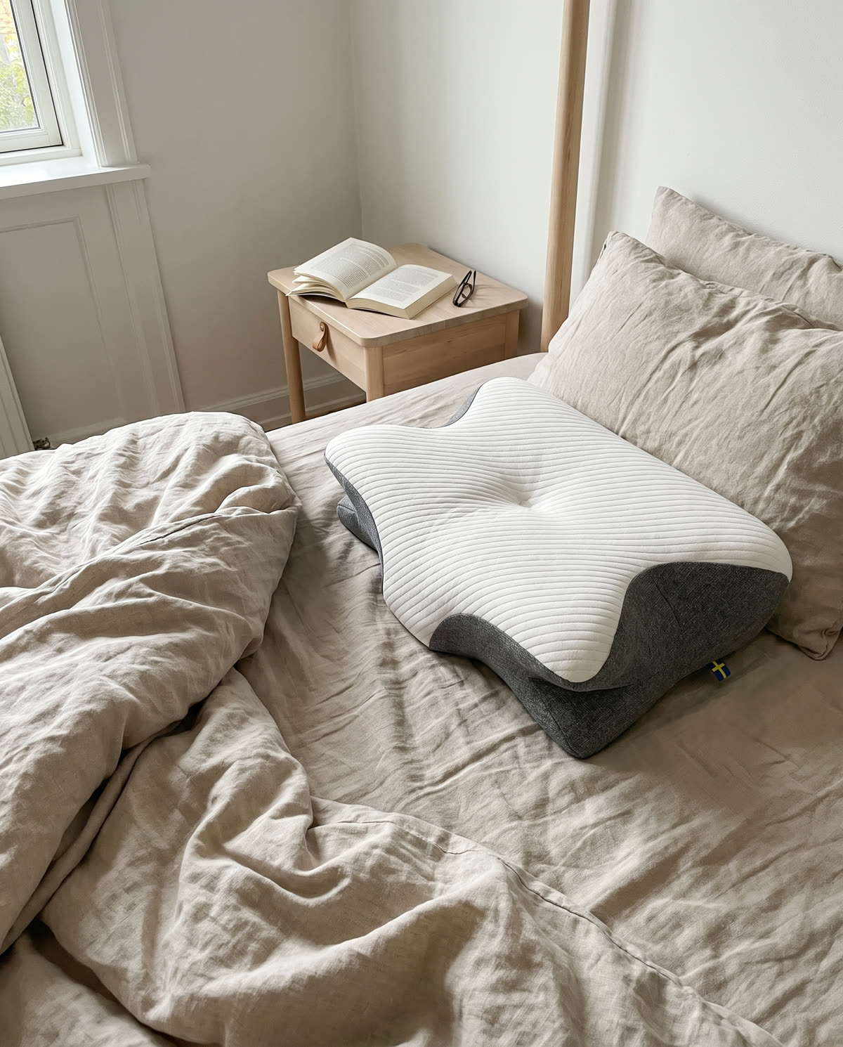 SleepEase sovepude på en seng i morgenlys